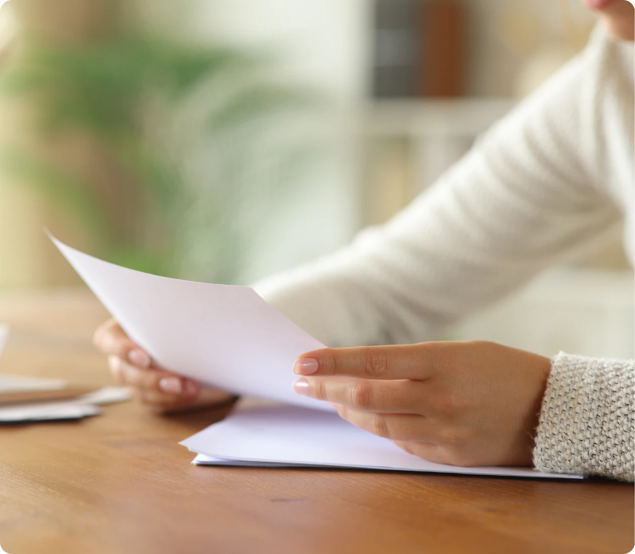 Close-up of hands with paper document